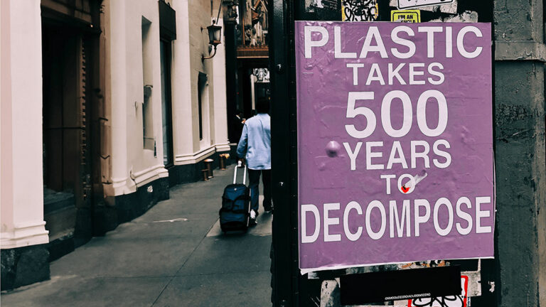 sign with text "plastic takes 500 years to decompose"